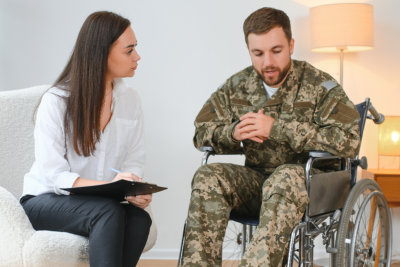 woman talking to a military man